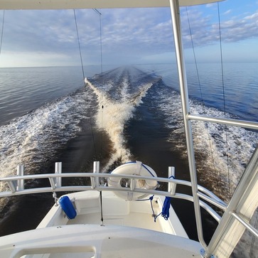  wake of boat offshore on a calm day